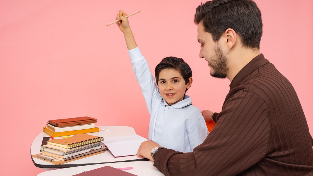 Teacher aids enthusiastic student in classroom setting, enhancing learning experience.